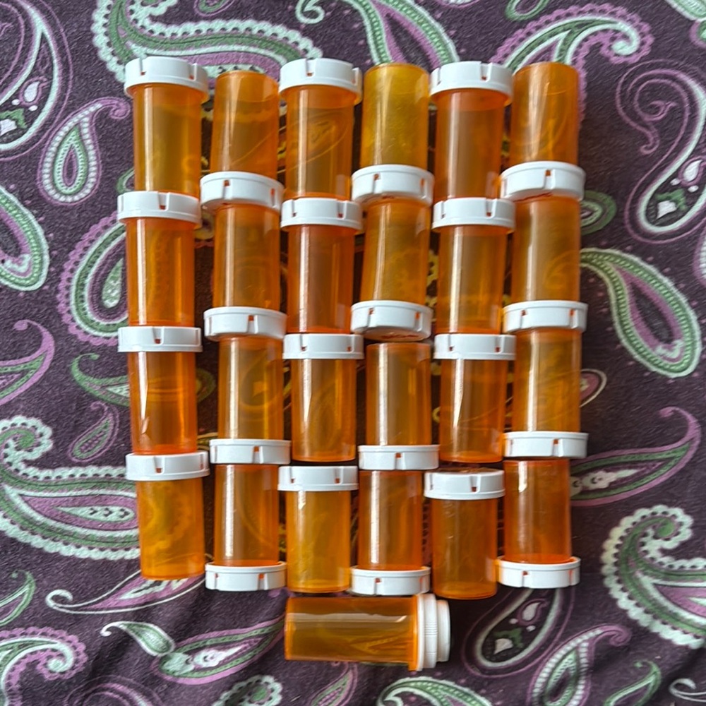 24 CVS pill bottles and 1 Walgreens approximately 3 inches. Small